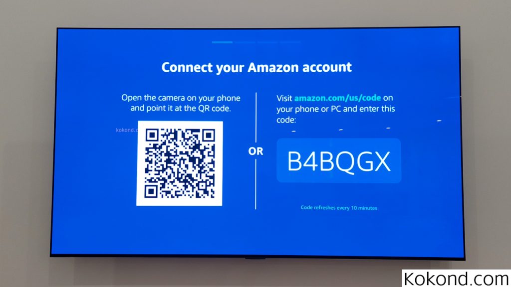 The user clicked on the "Get Started" option from the previous step and is now on a different screen. The backdrop is in dark blue color with the title on the top saying, "Connect your Amazon account." The screen is then divided in two parts suggesting either to scan a QR code through the camera on your phone or visit amazon.com/us/code and then enter the code shown on your screen. The left part of the screen displays the QR code and the right part displays the code the user can enter through their phone or PC. The user can choose either of the options, whichever is feasible. 